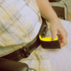 SB-1 Wheelchair Seat Belt being used on a patient sitting in a wheelchair.